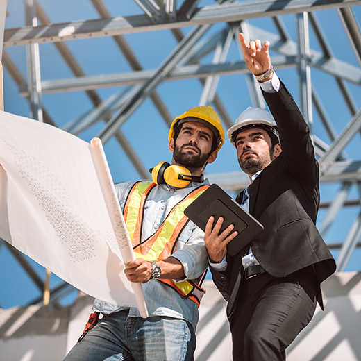 Project manager reviewing building plans