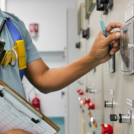 Technician recording readings