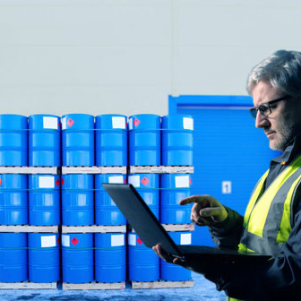 Storage drums labeled for hazardous material barcode tracking